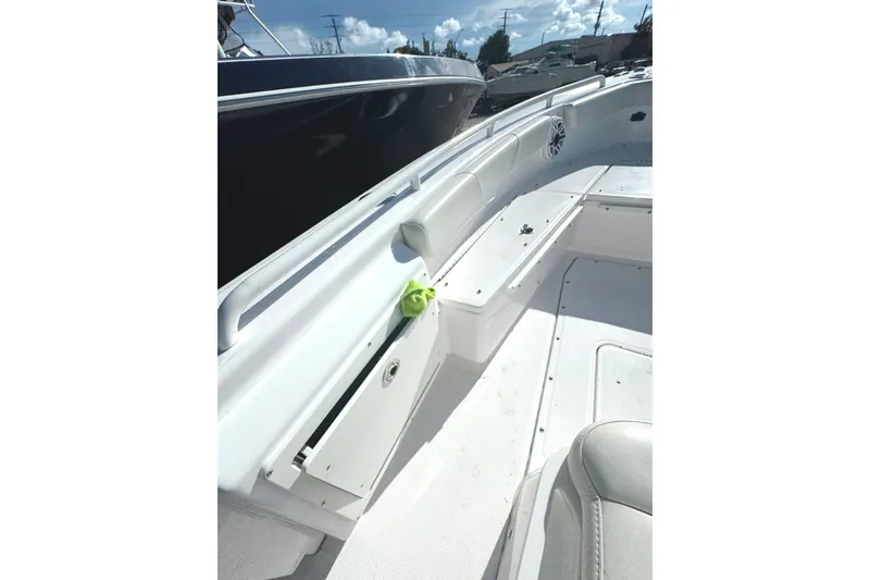 Slide: The Image of 2022 Everglades 243 Center Console boat interior with seating and storage compartments. - 17