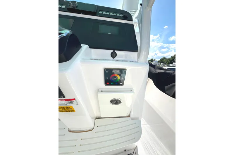 Slide: The Image of 2022 Everglades 243 Center Console dashboard with control panel and display screen. - 24