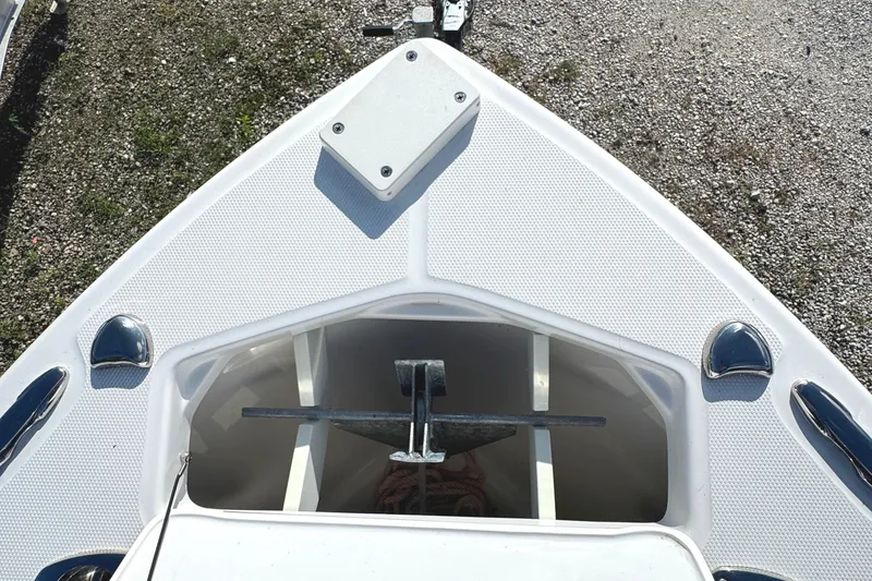 Slide: The Image of Bow of 2022 Everglades 243 Center Console boat with anchor storage. - 26