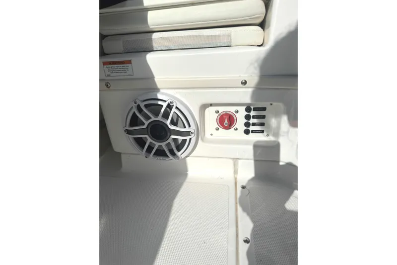 Slide: The Image of Speaker and control panel on 2022 Everglades 243 Center Console boat interior. - 30