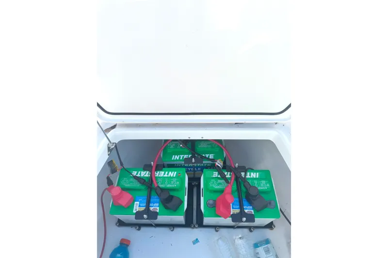 Slide: The Image of Battery compartment of 2022 Everglades 243 Center Console boat with Interstate batteries. - 33