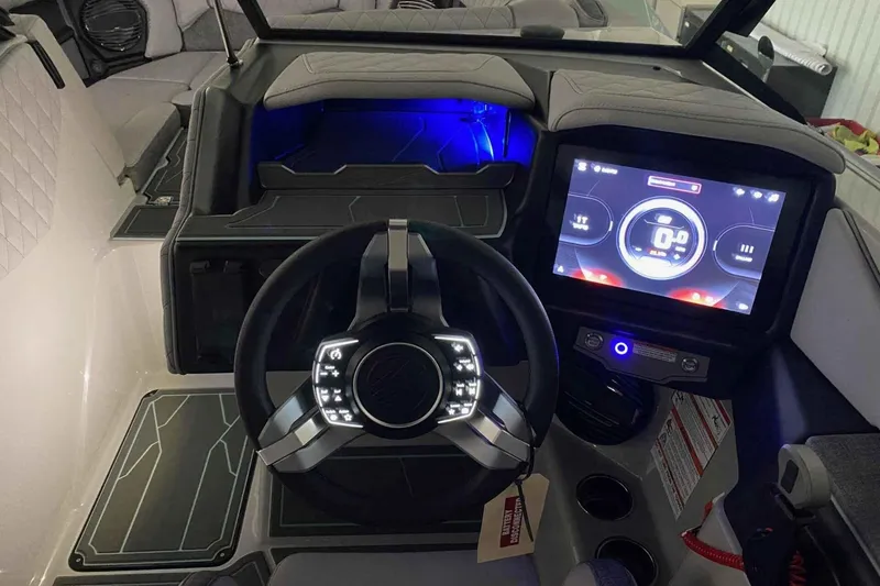 Slide: The Image of 2026 Tigé Z3 boat dashboard with illuminated steering wheel and digital display. - 7