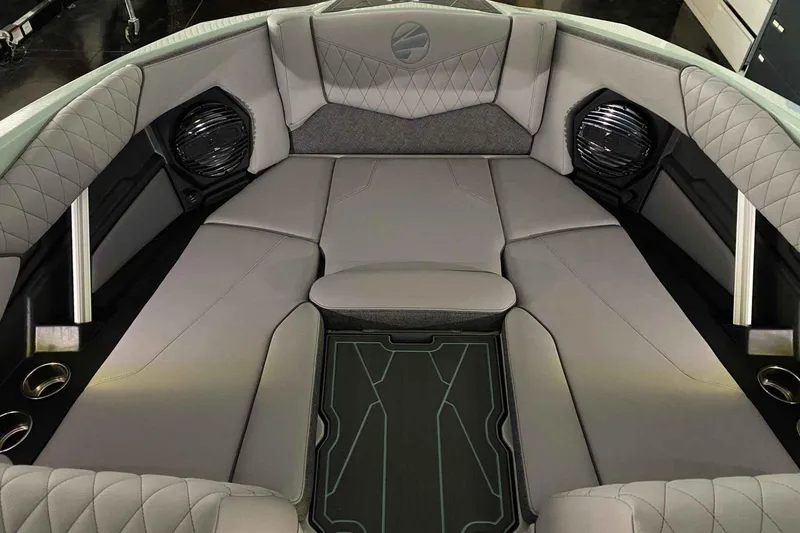 Slide: The Image of 2026 Tigé Z3 boat interior with gray cushioned seating and built-in speakers. - 9
