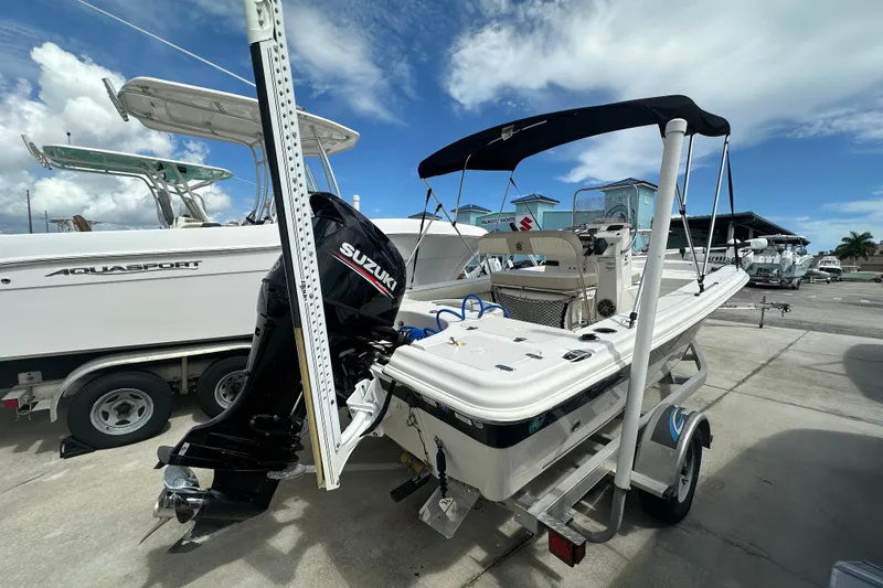 Slide: The Image of 2017 Carolina Skiff 21 Sea Skiff with Suzuki outboard motor on trailer. - 5