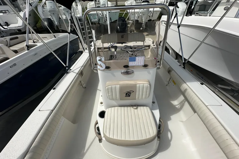 Slide: The Image of 2017 Carolina Skiff 21 Sea Skiff boat interior with seating and console. - 9