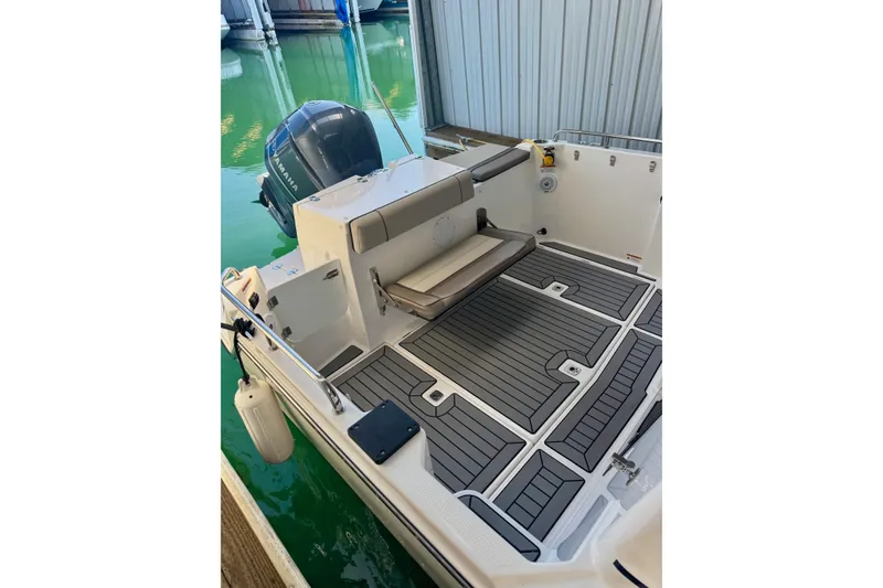 Slide: The Image of 2021 Cutwater C-24 Coupe boat with Yamaha outboard engine, docked in marina. - 12