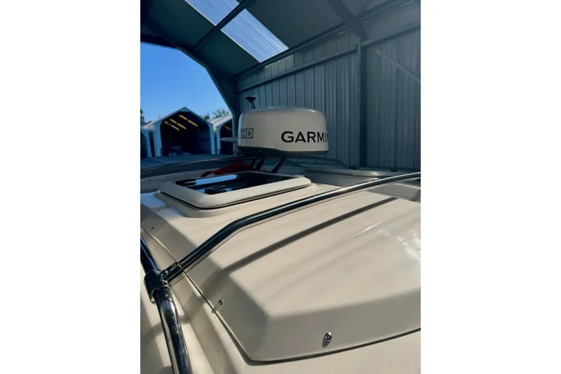 Slide: The Image of 2021 Cutwater C-24 Coupe with Garmin radar in a covered storage area. - 13