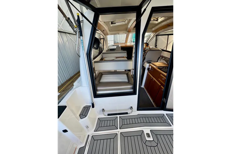 Slide: The Image of 2021 Cutwater C-24 Coupe interior with modern seating and sleek design. - 19