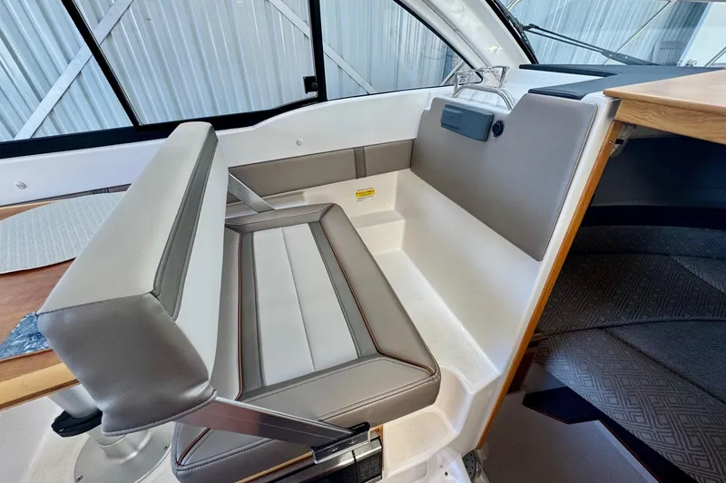 Slide: The Image of 2021 Cutwater C-24 Coupe interior seating with modern design and comfortable upholstery. - 25