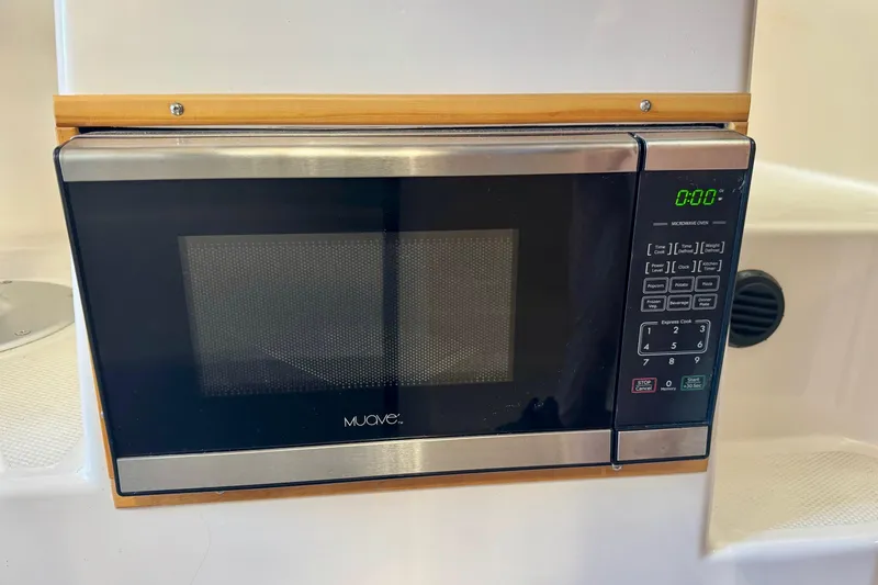 Slide: The Image of Built-in microwave in 2021 Cutwater C-24 Coupe boat kitchen area. - 31