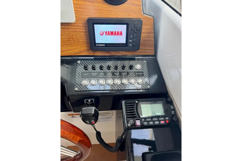 Slide: The Image of 2021 Cutwater C-24 Coupe dashboard with Yamaha display and control panel. - 34