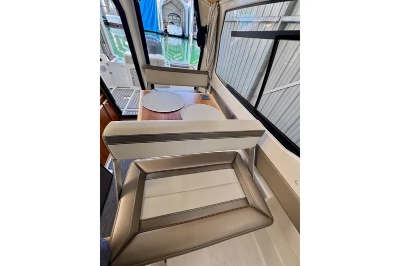 Slide: The Image of 2021 Cutwater C-24 Coupe interior with elegant seating and table setup. - 42