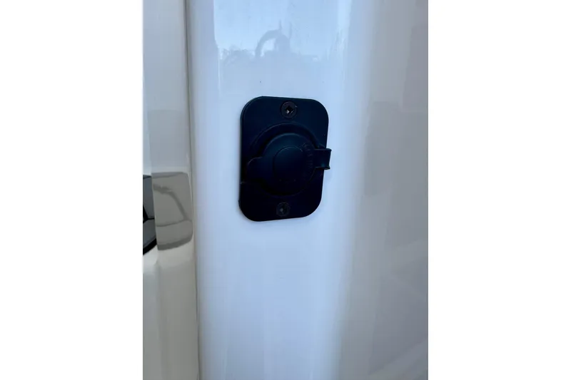 Slide: The Image of Black outlet cover on 2021 Cutwater C-24 Coupe boat exterior. - 45