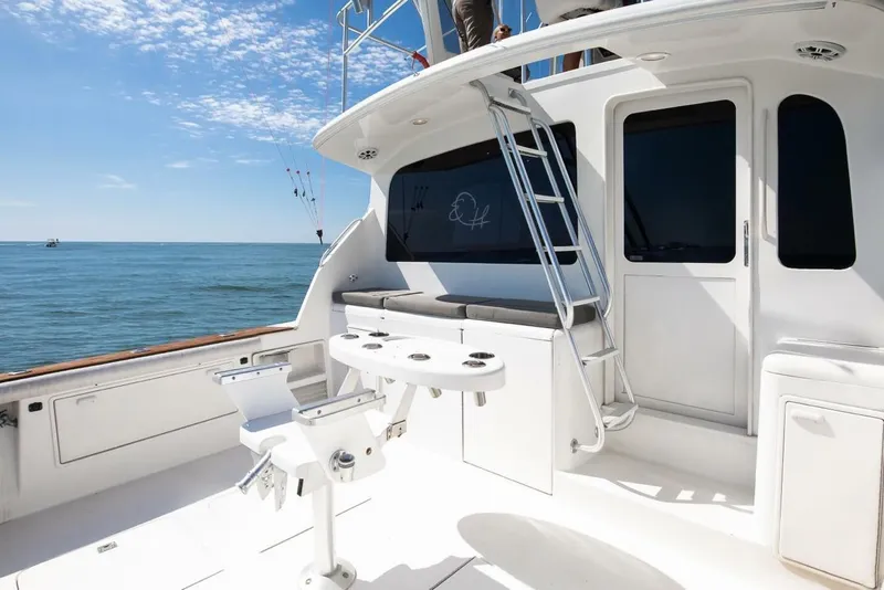 Slide: The Image of 1999 Ocean Yachts 48 Super Sport boat deck with fishing chair and ocean view. - 13