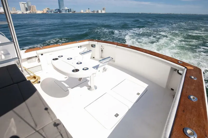 Slide: The Image of 1999 Ocean Yachts 48 Super Sport cruising with city skyline in background. - 14