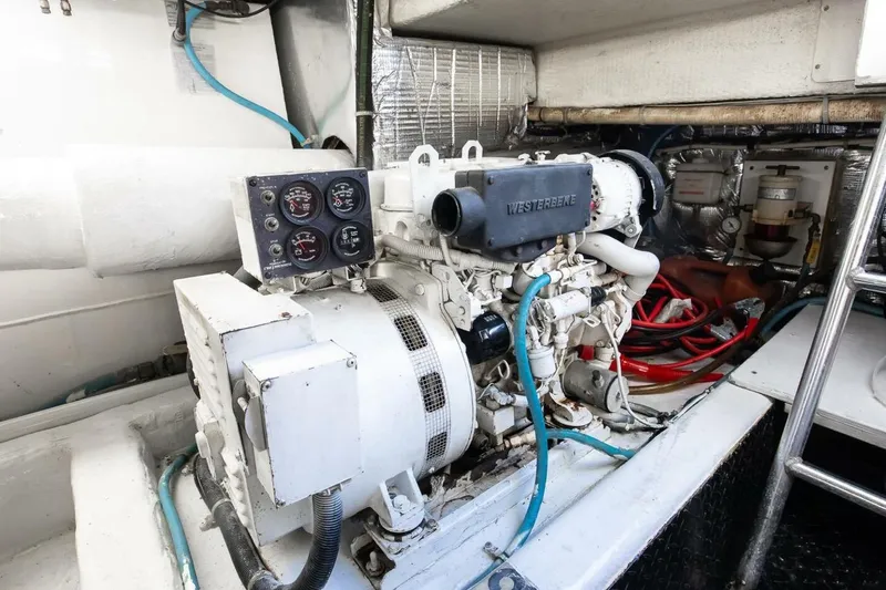Slide: The Image of Engine room of 1999 Ocean Yachts 48 Super Sport with Westerbeke generator. - 16