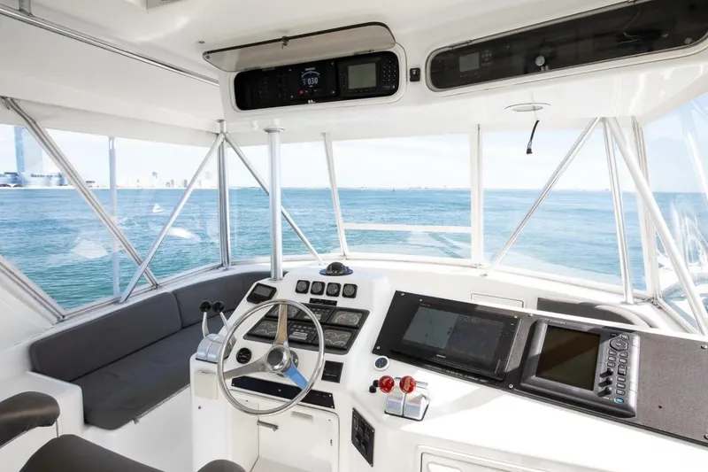 Slide: The Image of Cockpit of 1999 Ocean Yachts 48 Super Sport with ocean view and navigation equipment. - 4