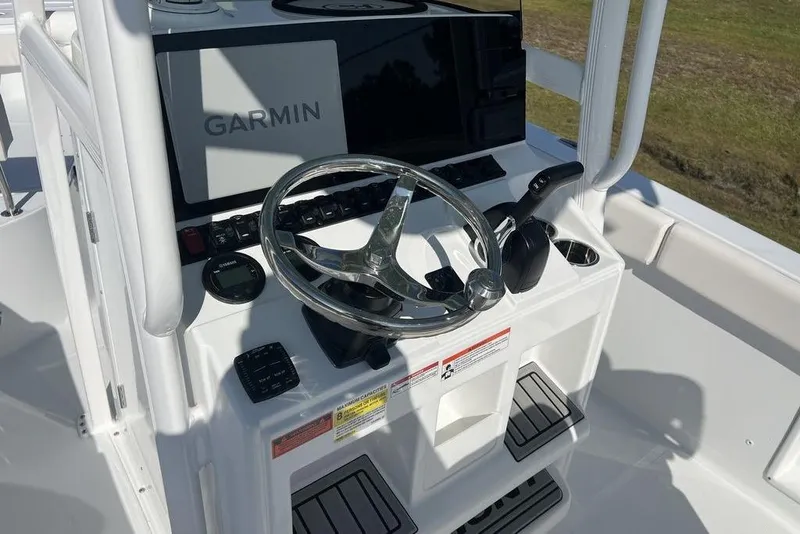 Slide: The Image of Steering console of 2026 Sea Hunt Ultra 219 boat with Garmin navigation system. - 13