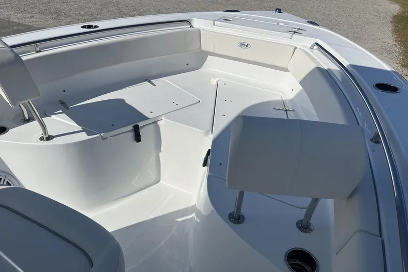 Slide: The Image of 2026 Sea Hunt Ultra 219 boat interior with seating and storage compartments. - 14