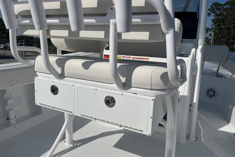 Slide: The Image of 2026 Sea Hunt Ultra 219 boat interior with cushioned seating and storage compartments. - 16