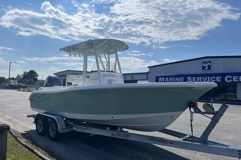Slide: The Image of 2026 Sea Hunt Ultra 219 boat on trailer at marine service center. - 3