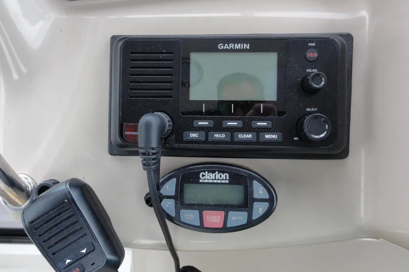 Slide: The Image of Garmin and Clarion marine electronics on 2004 Sea Ray 320 Sundancer dashboard. - 12