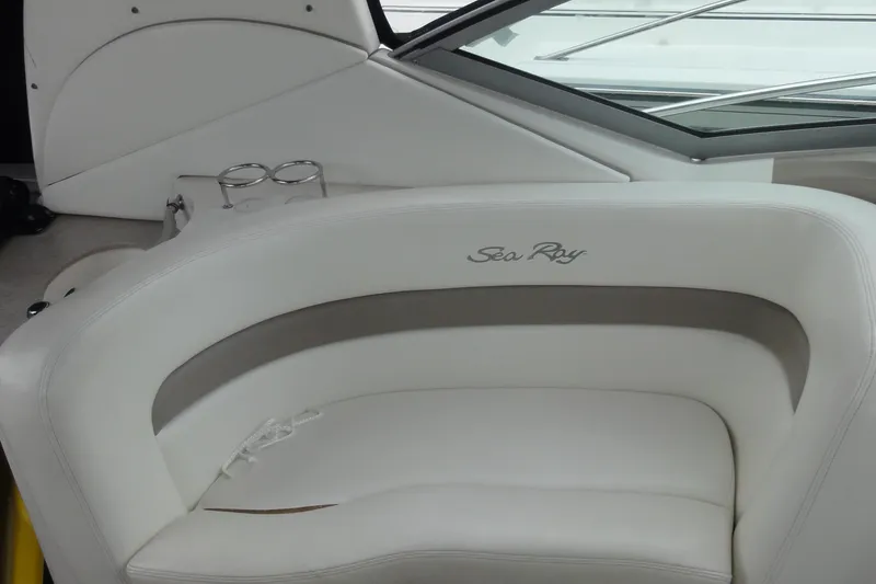 Slide: The Image of Luxurious seating on 2004 Sea Ray 320 Sundancer boat with cup holders. - 14
