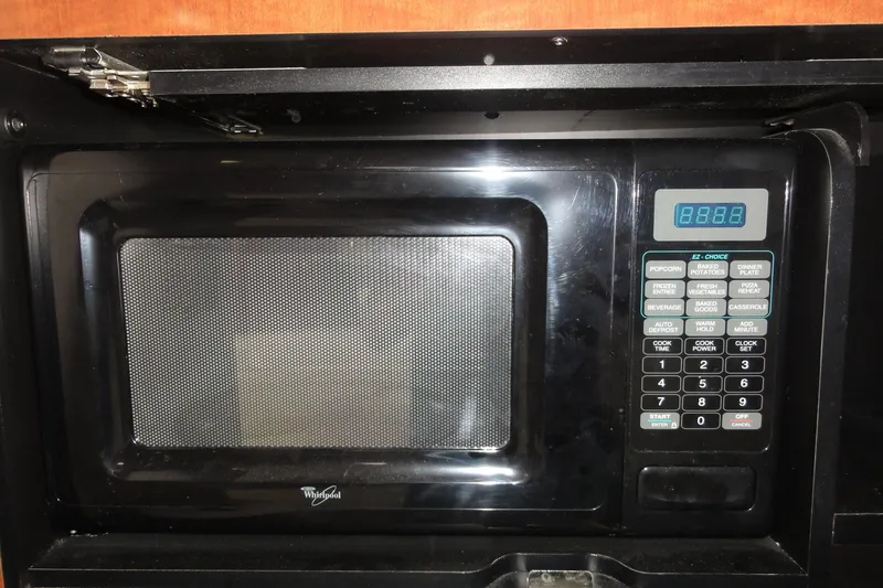 Slide: The Image of Built-in Whirlpool microwave in 2004 Sea Ray 320 Sundancer yacht kitchen. - 23