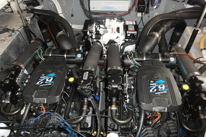 Slide: The Image of Engine room of a 2004 Sea Ray 320 Sundancer with twin MerCruiser 6.2 MPI engines. - 26
