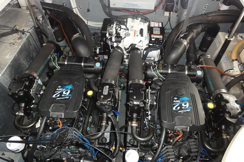 Slide: The Image of Engine room of 2004 Sea Ray 320 Sundancer with twin MerCruiser 6.2L engines. - 28