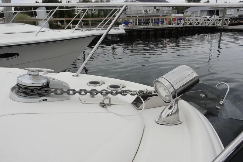 Slide: The Image of 2004 Sea Ray 320 Sundancer boat anchor and chain detail at marina. - 5