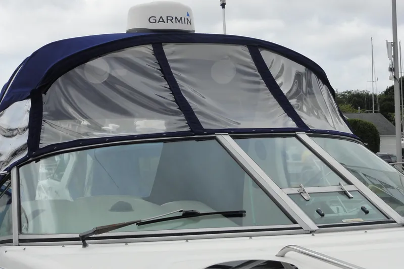 Slide: The Image of 2004 Sea Ray 320 Sundancer boat with Garmin radar and clear canopy. - 6