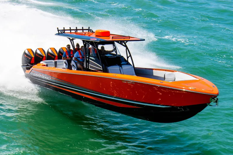 Slide: The Image of 2026 Nor-Tech 390 Sport Center Console boat interior with stylish seating and modern design. - 12