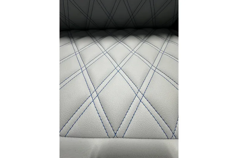 Slide: The Image of Quilted white leather seat with blue stitching in 2026 Nor-Tech 390 Sport Center Console. - 13
