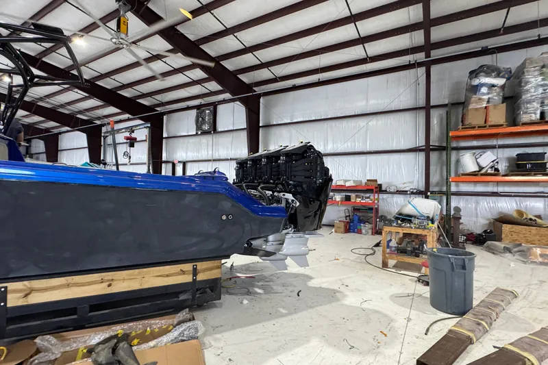 Slide: The Image of 2026 Nor-Tech 390 Sport Center Console in a workshop, showcasing its sleek design and powerful engines. - 7