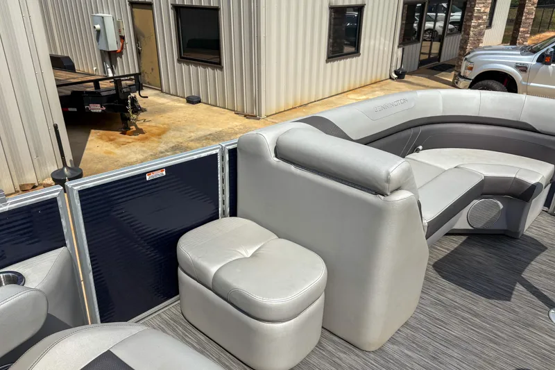 Slide: The Image of 2022 Bennington SX 22 boat interior with gray seating and modern design. - 12