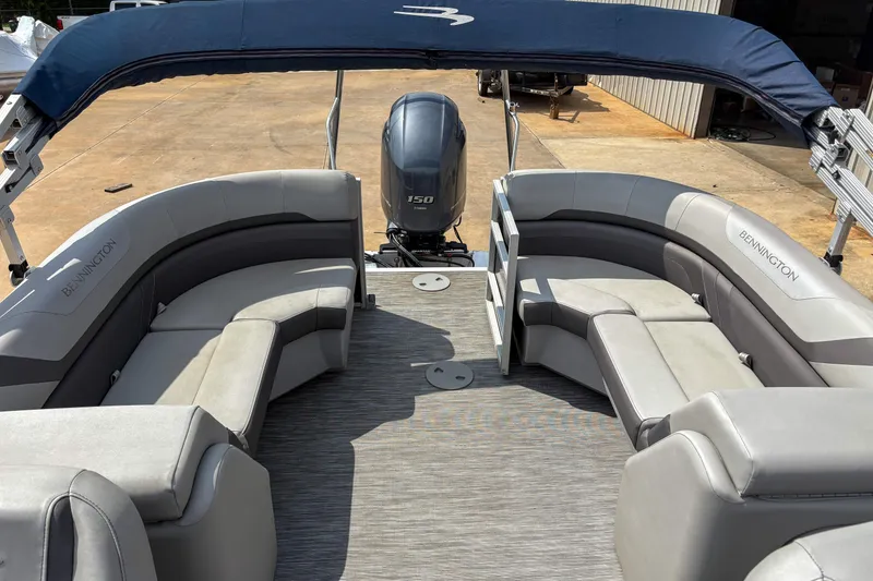 Slide: The Image of 2022 Bennington SX 22 pontoon boat with spacious seating and canopy. - 6