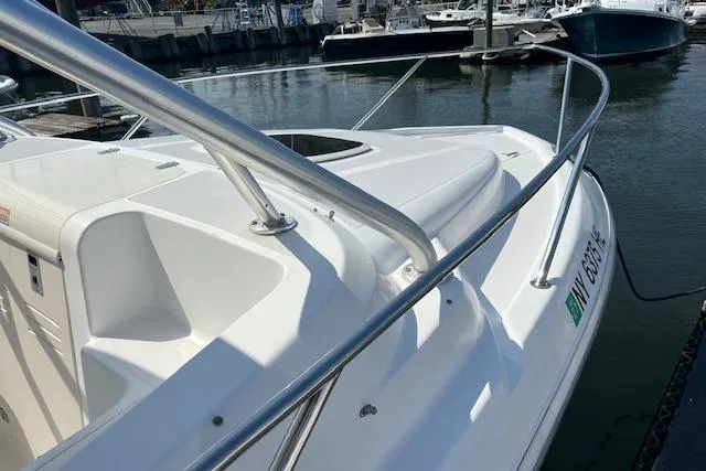 Slide: The Image of 2006 Boston Whaler 320 Outrage Cuddy Cabin docked in marina. - 17