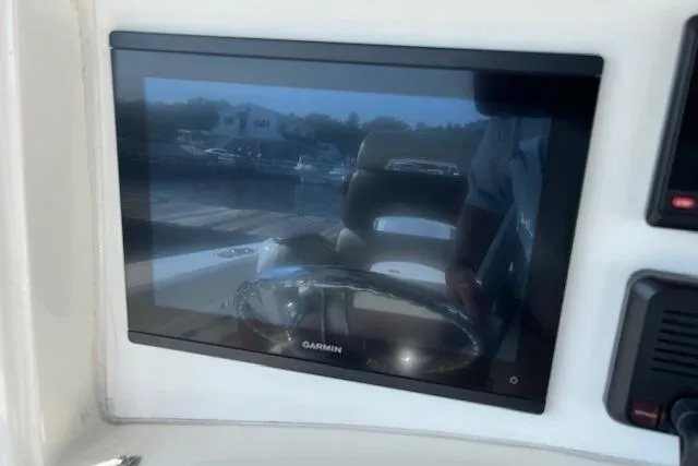 Slide: The Image of Garmin display on 2006 Boston Whaler 320 Outrage Cuddy Cabin boat dashboard. - 24