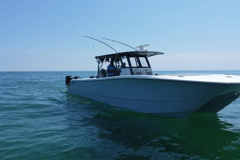 Slide: The Image of Helm of 2022 Invincible 46 Catamaran with Garmin navigation displays and controls. - 21