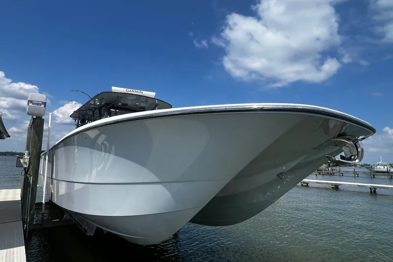 Slide: The Image of 2022 Invincible 46 Catamaran docked, showcasing sleek design and advanced features. - 26