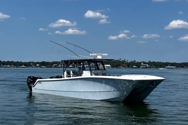 Slide: The Image of 2022 Invincible 46 Catamaran with Mercury engines docked at marina. - 33