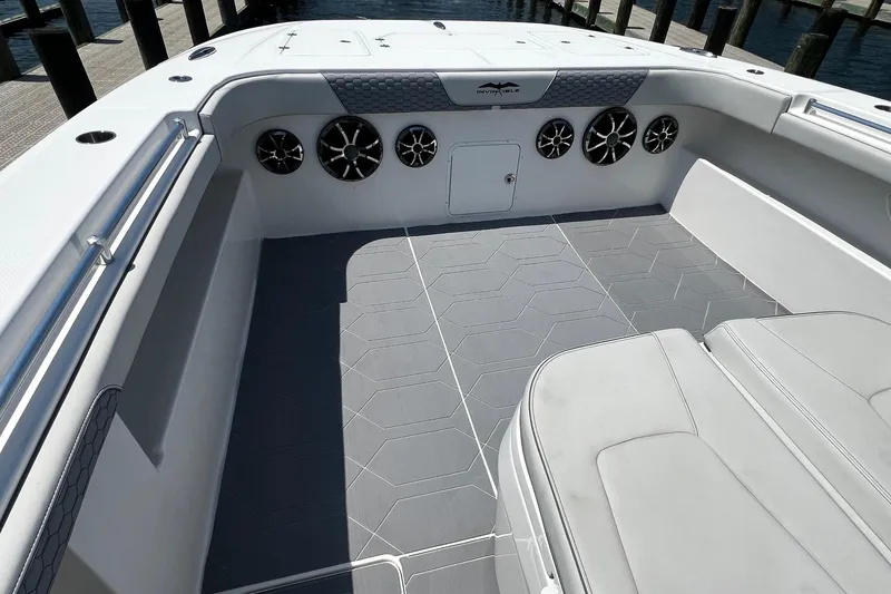 Slide: The Image of 2022 Invincible 46 Catamaran interior with cushioned seating and sleek design. - 44
