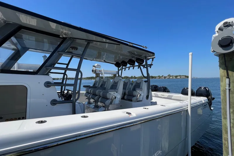 Slide: The Image of 2022 Invincible 46 Catamaran docked, showcasing sleek design and modern features. - 50