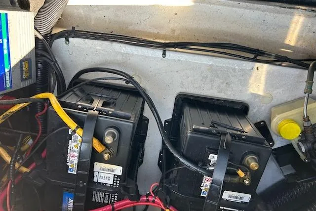 Slide: The Image of 2005 Chris-Craft Speedster engine compartment with dual batteries and wiring. - 10