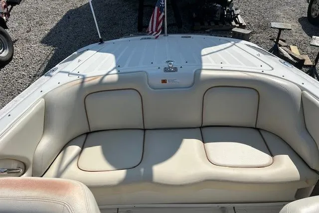 Slide: The Image of 2005 Chris-Craft Speedster boat interior with white leather seating and American flag. - 7