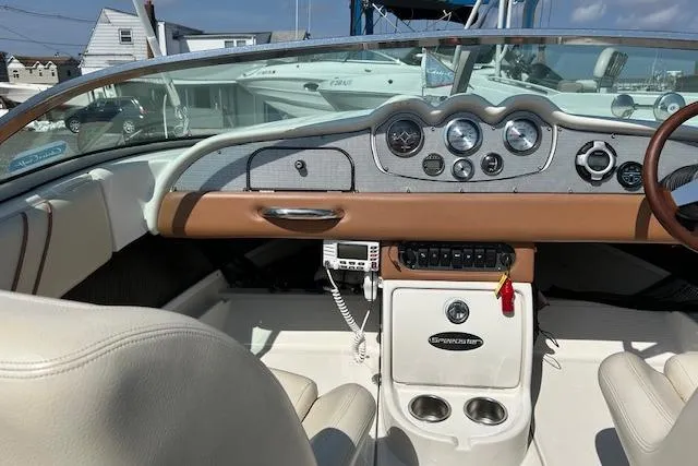 Slide: The Image of 2005 Chris-Craft Speedster boat interior with classic dashboard and steering wheel. - 8