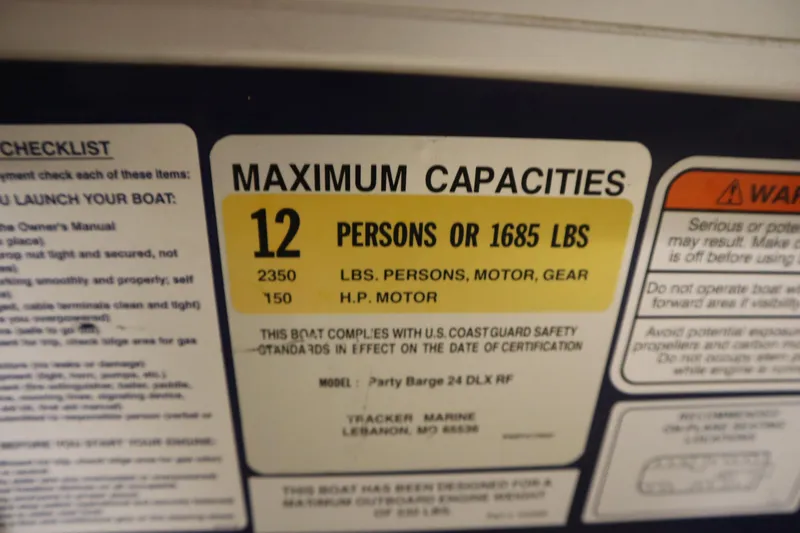 Slide: The Image of 2014 Sun Tracker Party Barge 24 DLX capacity label, 12 persons or 1685 lbs. - 23