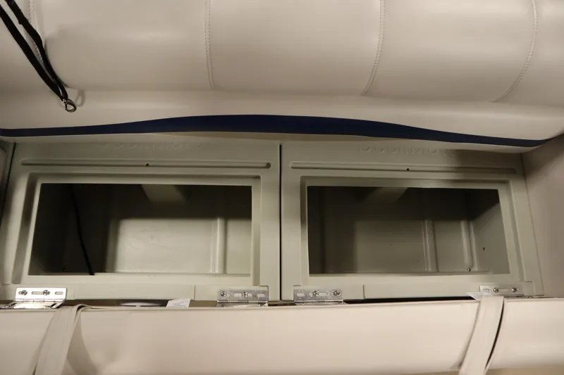 Slide: The Image of 2014 Sun Tracker Party Barge 24 DLX storage compartments under seat. - 25