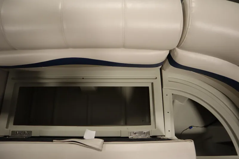 Slide: The Image of Interior seating of 2014 Sun Tracker Party Barge 24 DLX with storage compartment. - 28